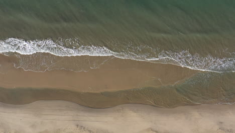 Shore-beach-Espiguette-waves-aerial-top-down-shot-France-sunny-day-sandy